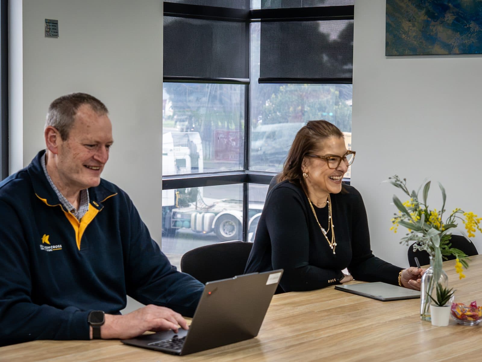 A business owner and an IT advisor working through a plan together