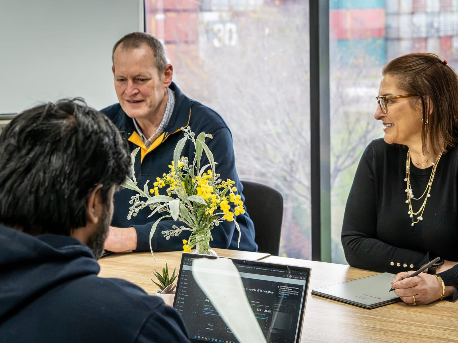An SCCS service review meeting around the boardroom table